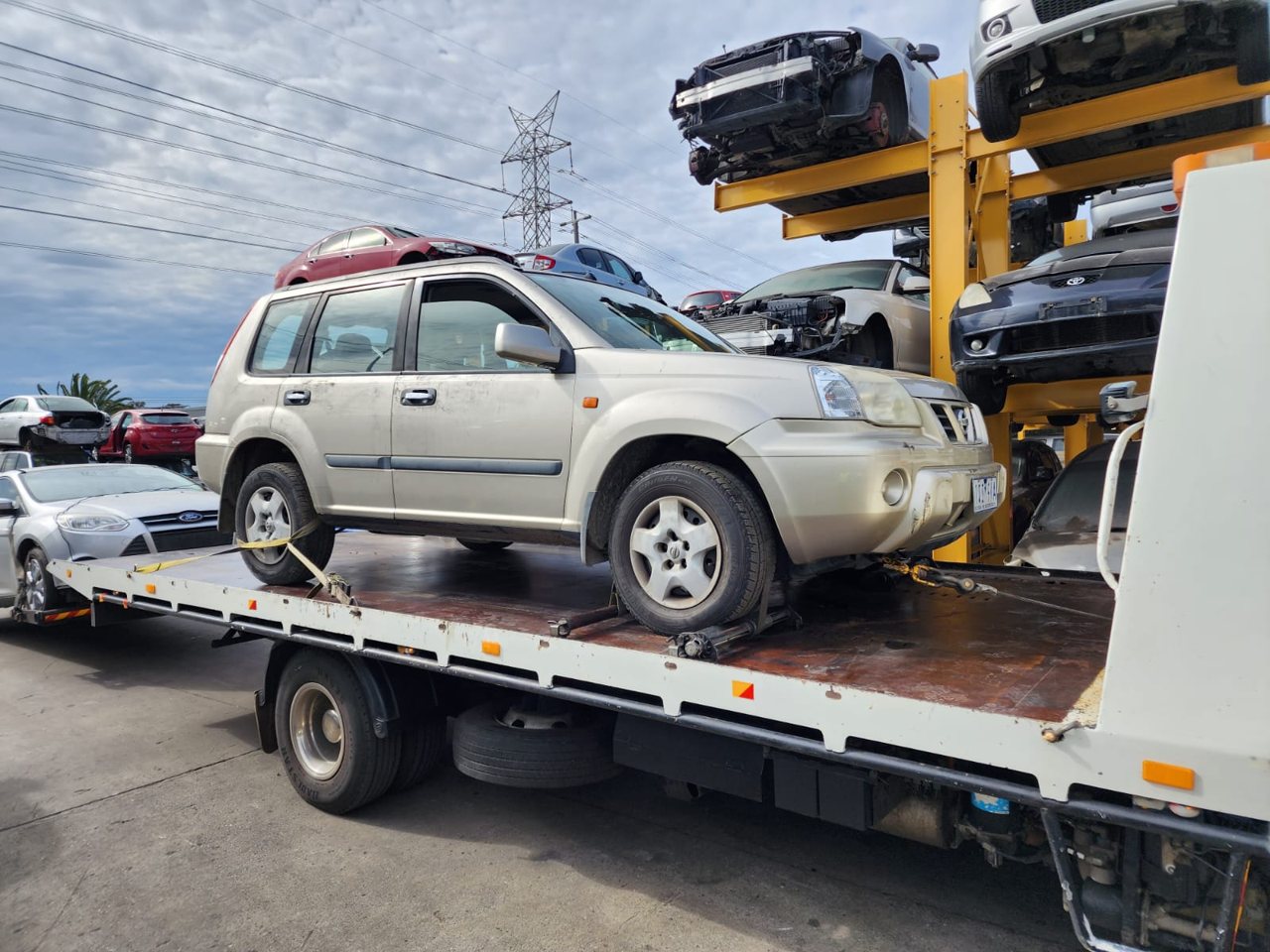 Light-coloured SUV loaded for transport