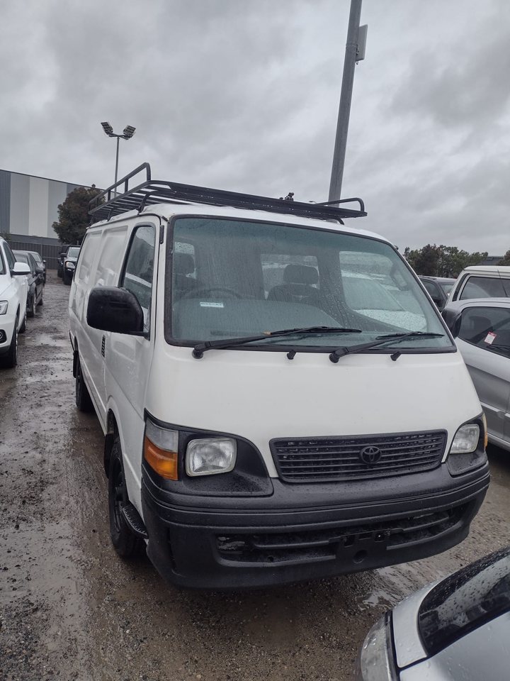 White van with roof racks