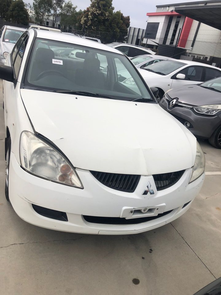 White sedan viewed from the front
