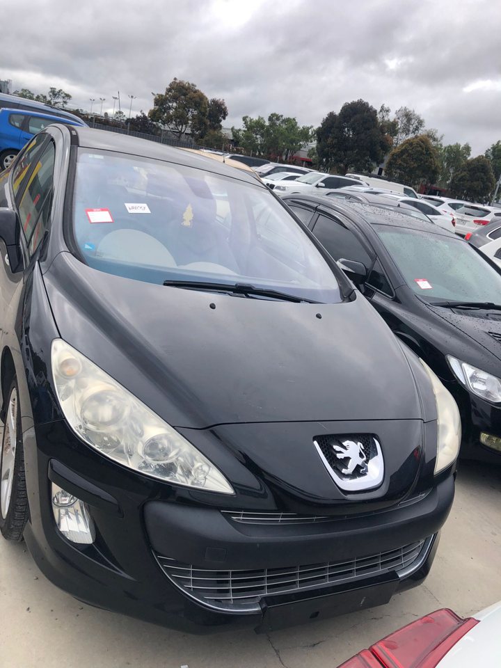 Dark hatchback viewed from the front
