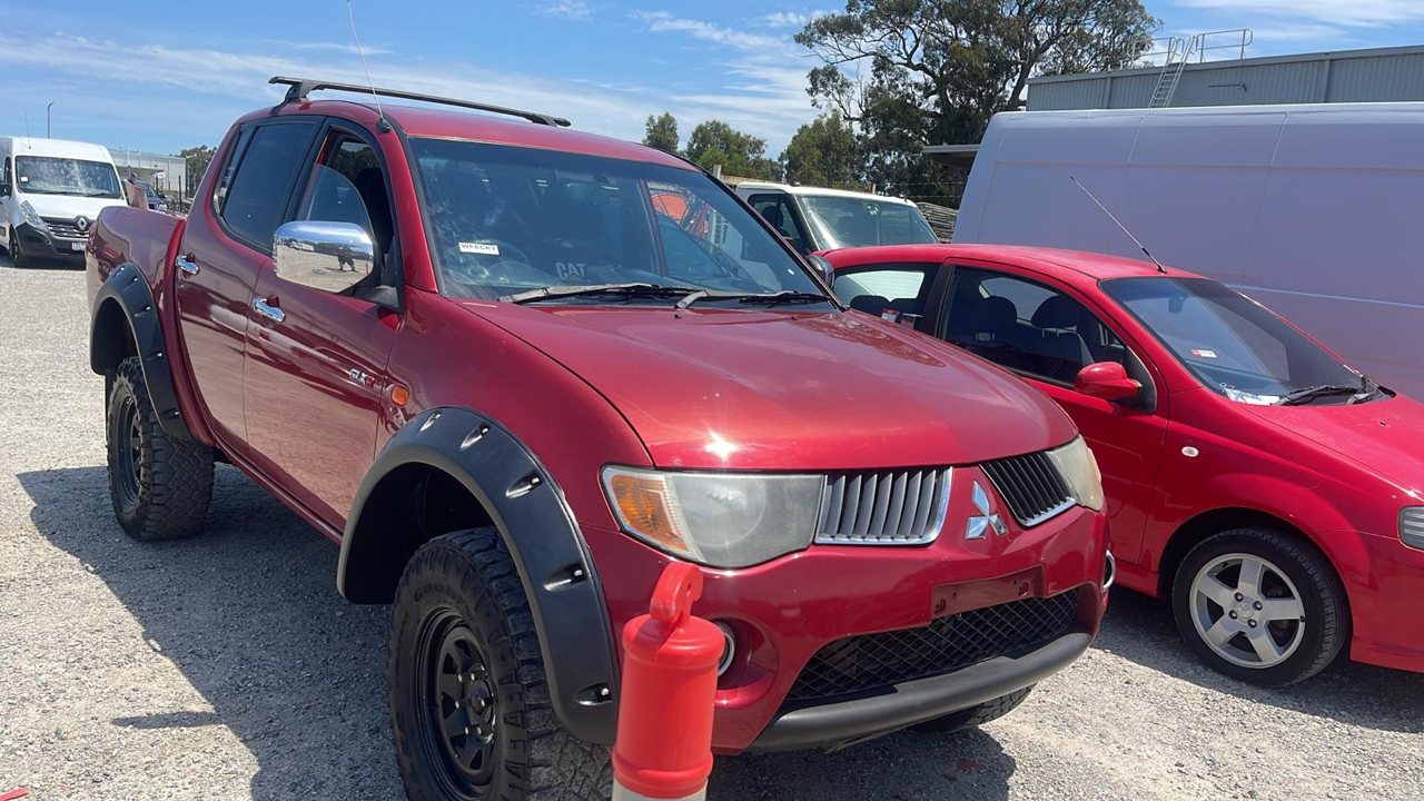 Red utility vehicle parked outside