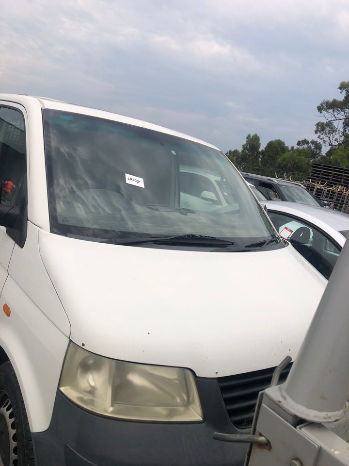 White van parked beside another vehicle