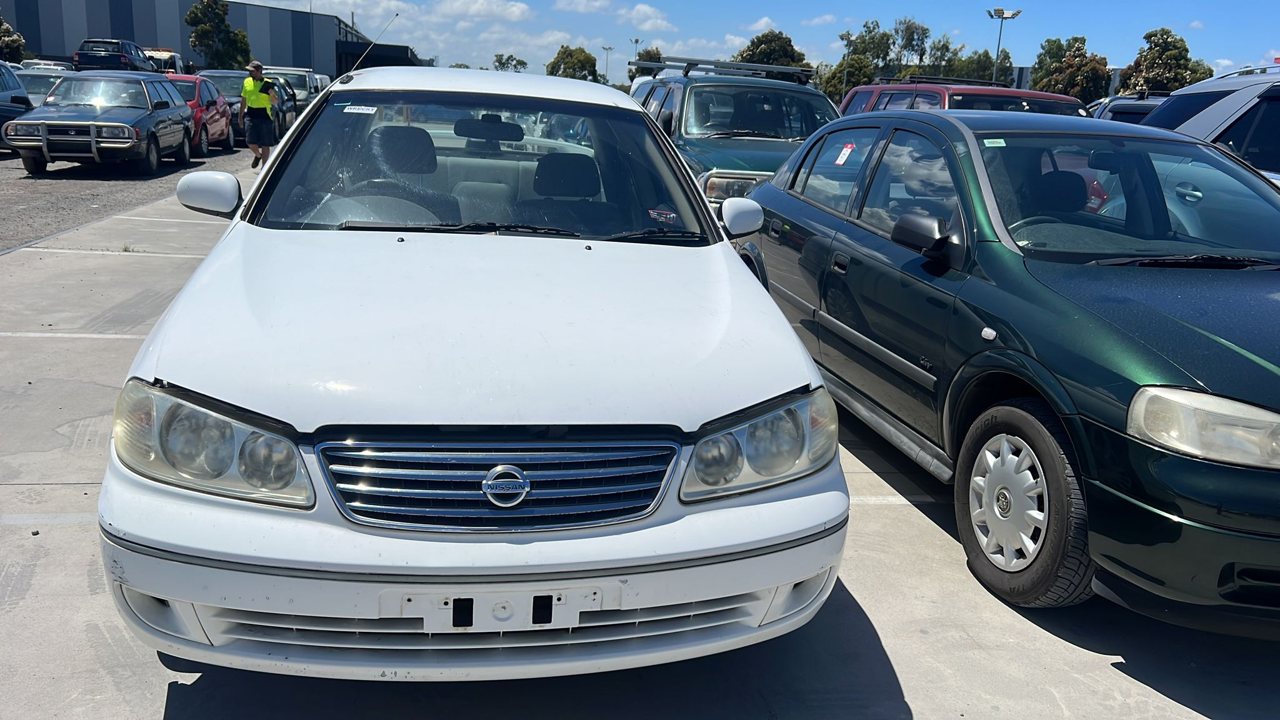 White sedan viewed from the front