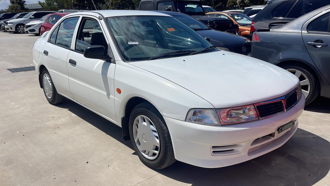 White sedan with dark bumper trim